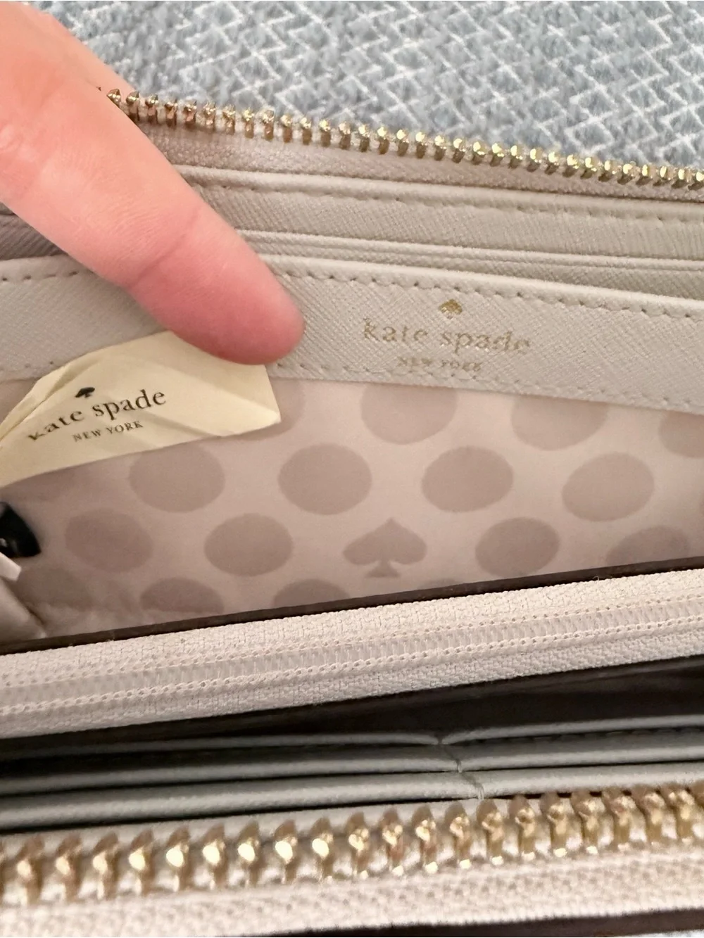 Kate Spade gray zip-around saffiano leather wallet with gold logo